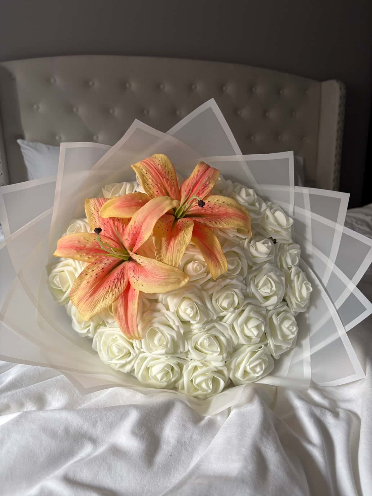 White eternal roses with orange lilies