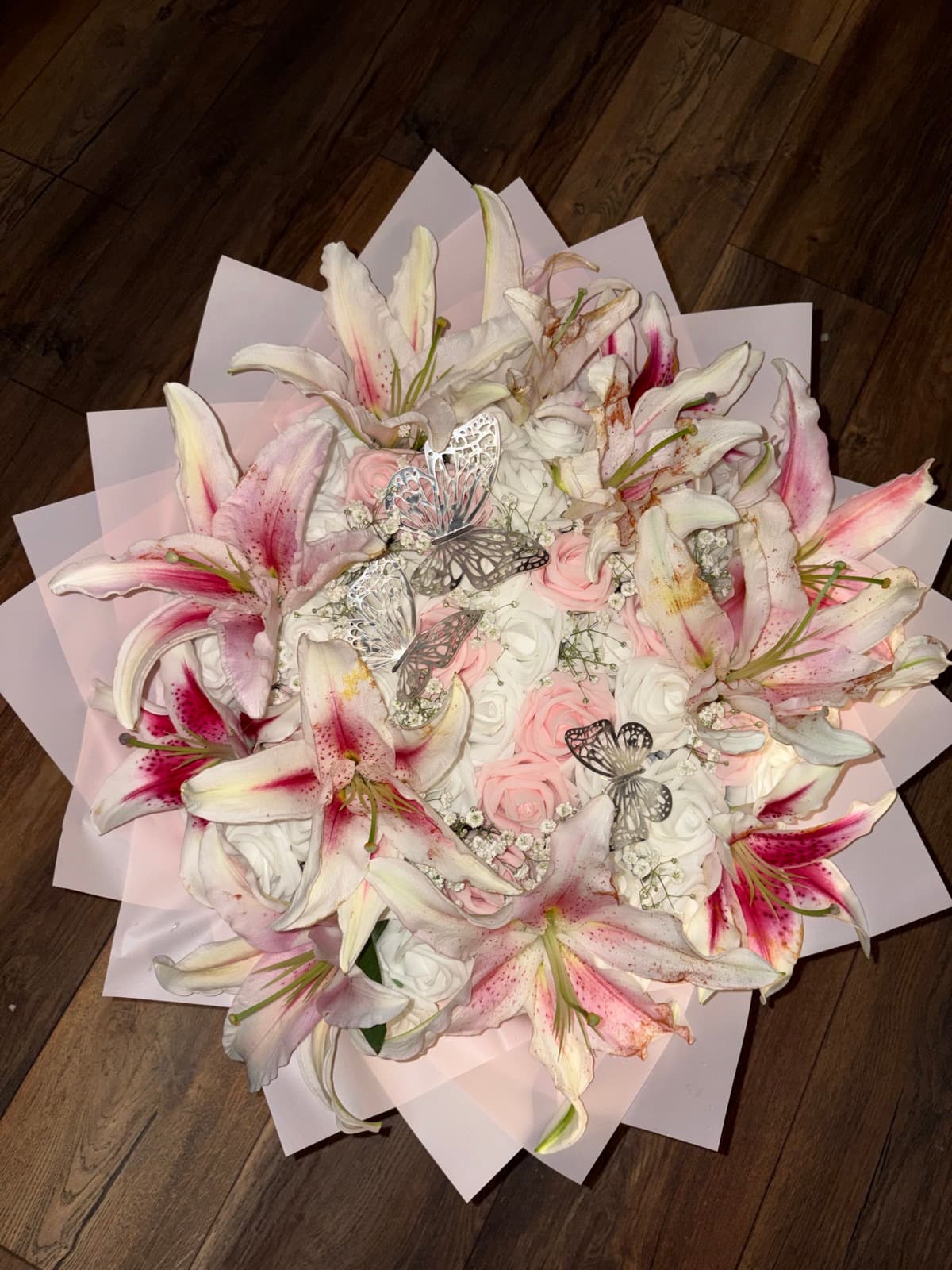 Blush roses with lilies and butterflies
